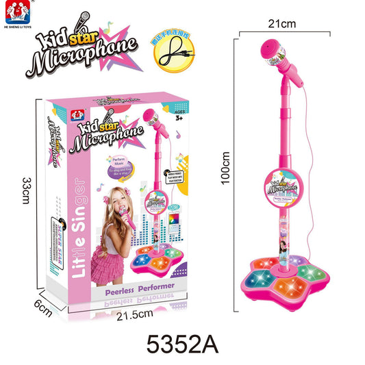 Pink toy microphone with stand and packaging labeled 'Kid Star Microphone' on a white background.